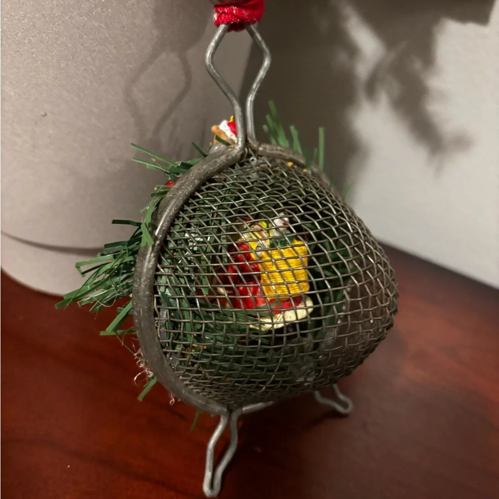 Handmade Santa Holiday Wreath on an old tea strainer.